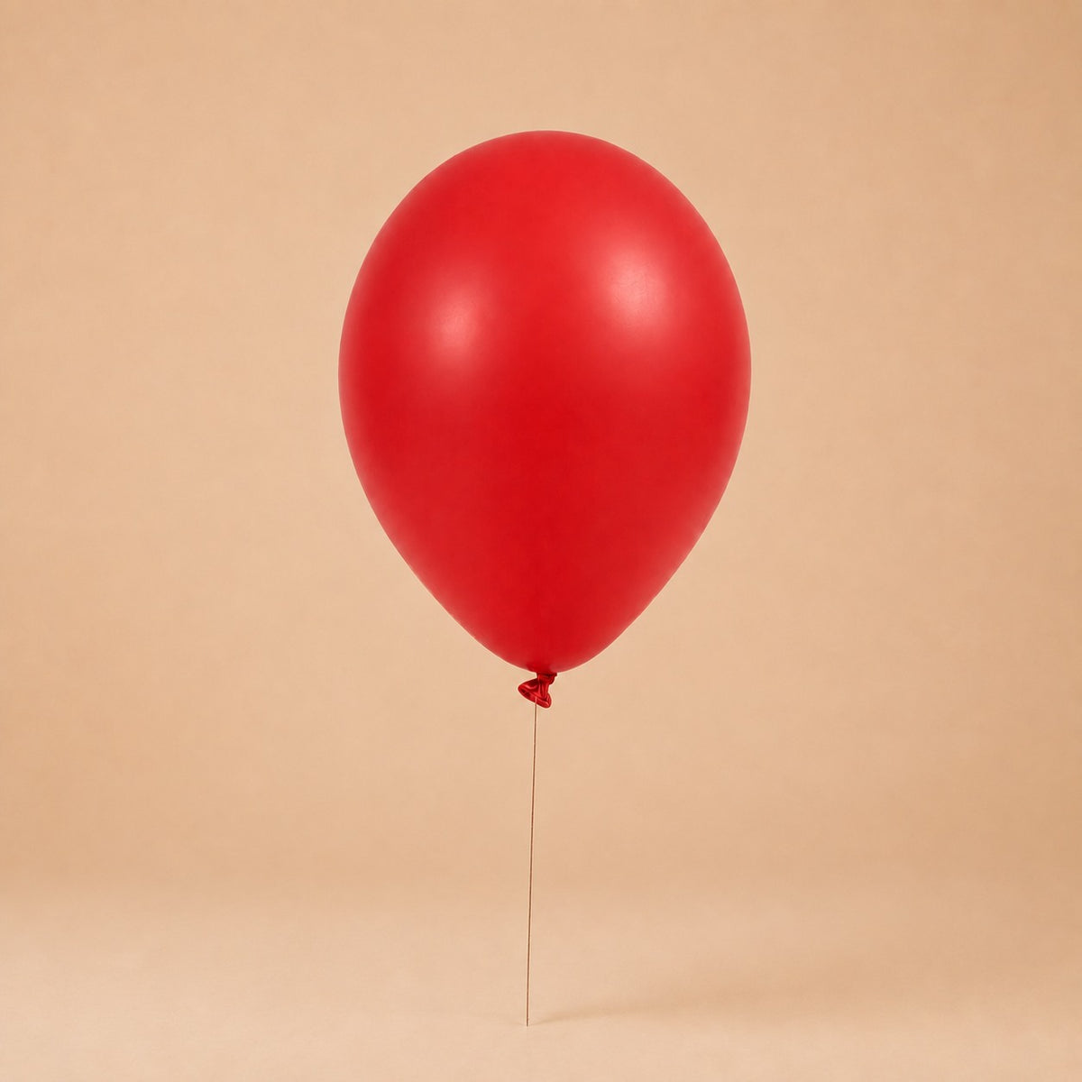 Red helium balloon add-on, tied to a Bloomistry flower arrangement