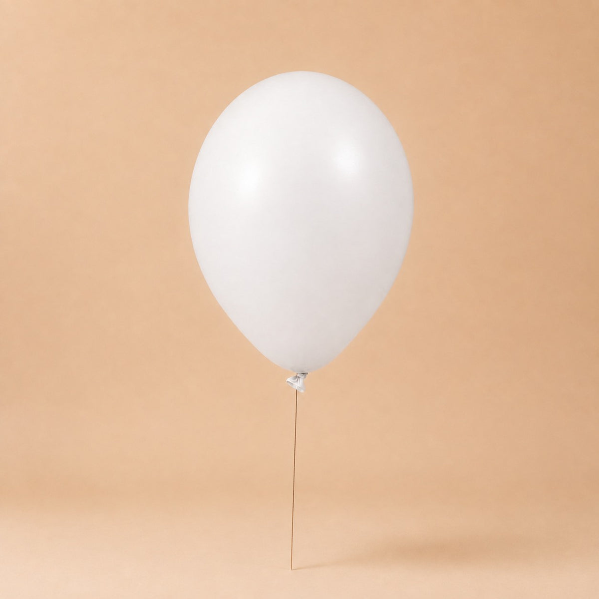 White helium balloon add-on, tied to a Bloomistry flower arrangement