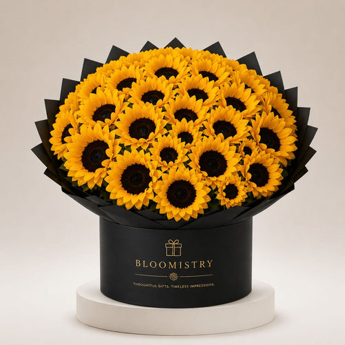 Golden Helianthus Noir — sunflower arrangement in black delivered across the UAE by Bloomistry