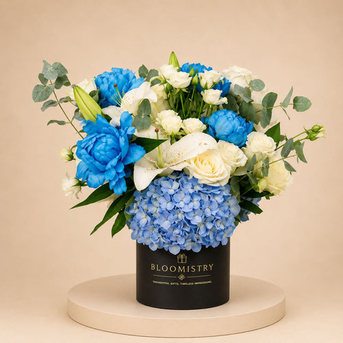 Sapphire Blooms in Box — blue flower arrangement delivered across the UAE by Bloomistry